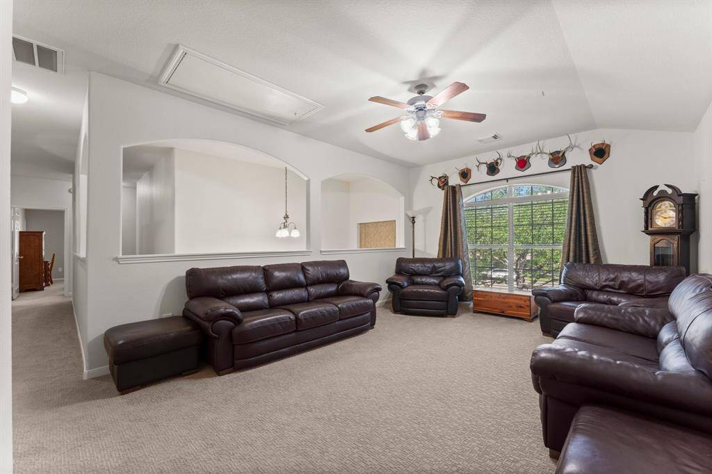 The versatile upstairs loft offers extra living space, perfect for a media room, playroom, or second family area.