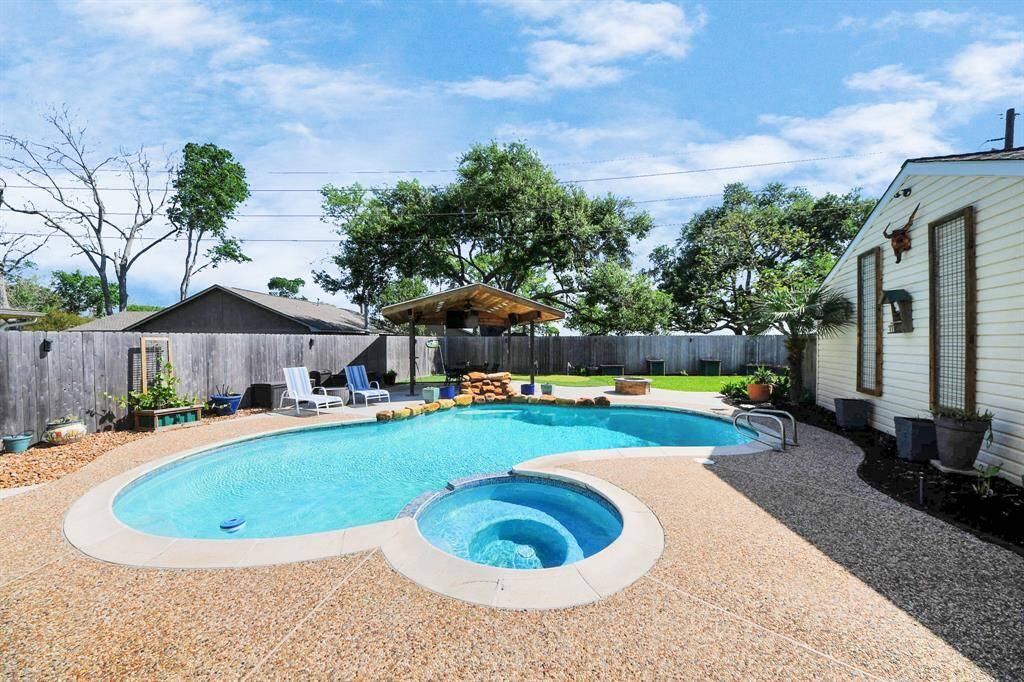 Imagine coming home to your own private resort—complete with a sparkling pool and spa, a putting green, fire pit, and a sprawling covered patio designed for year-round relaxation. Welcome to 2519 Country Place!