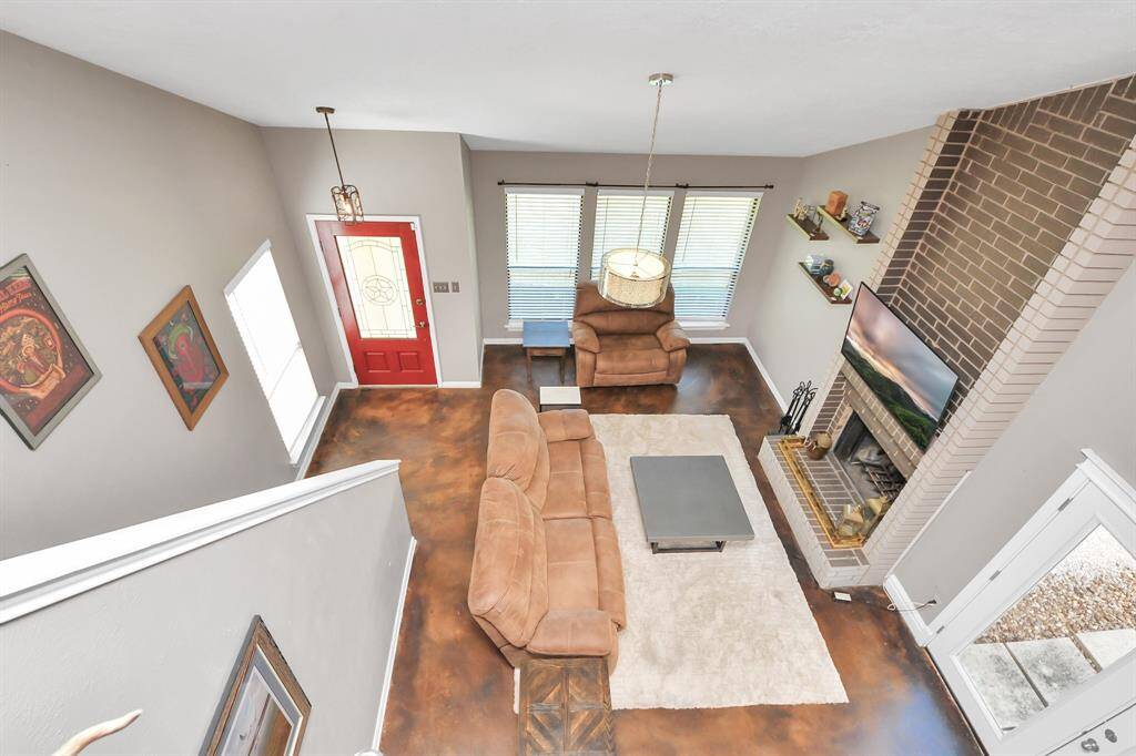 A view from above reveals the magnificent den adding to the homes overall flow and appeal.