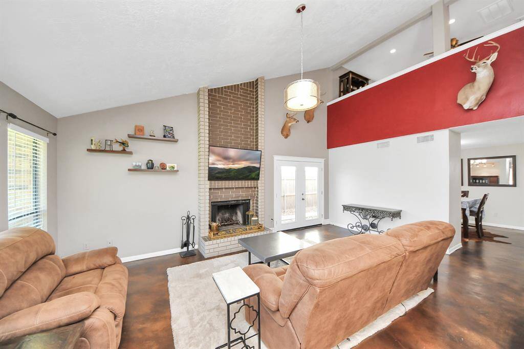 The open-concept living area offers both comfort and character. The space is designed for gathering, relaxing, and making memories.