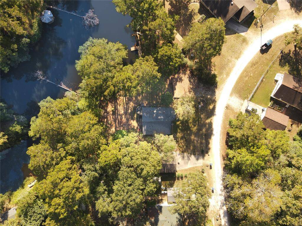 Bird's-eye view of your serene, tree-enclosed property.