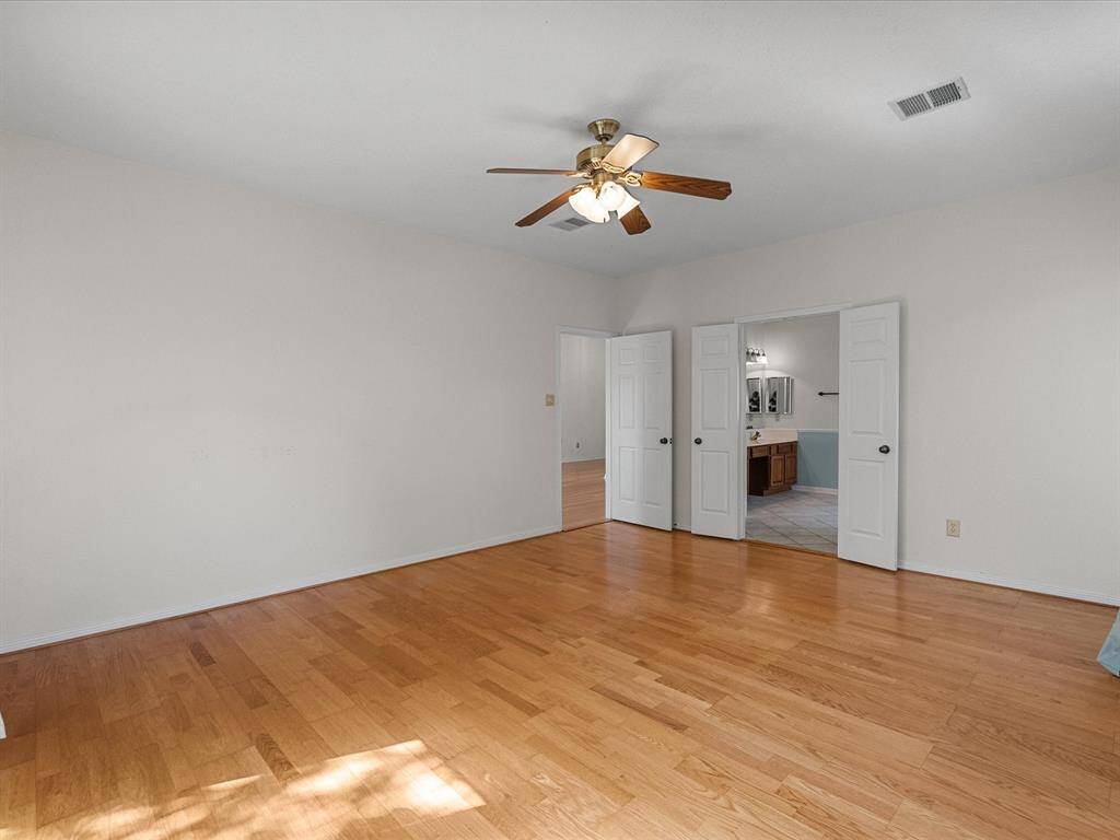 Double door entry to the ensuite bath and ample room for king-sized furnishings.