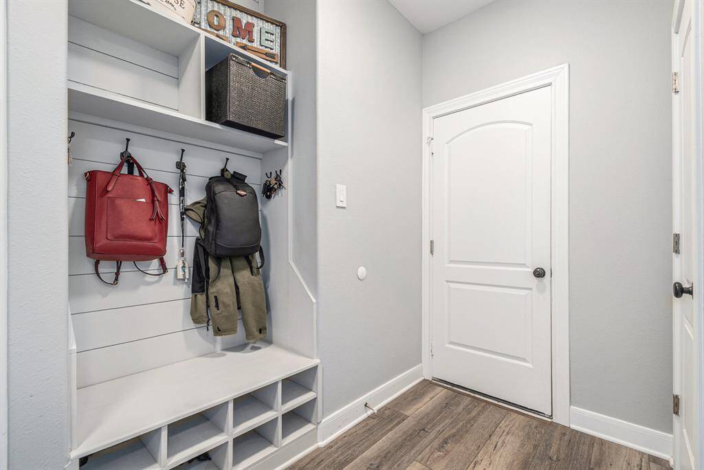 Back entry from garage with custom built hall tree cubby area