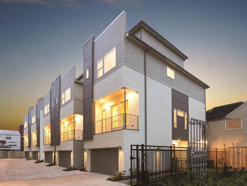 Gated Community Home with 2nd story balcony & rooftop terrace