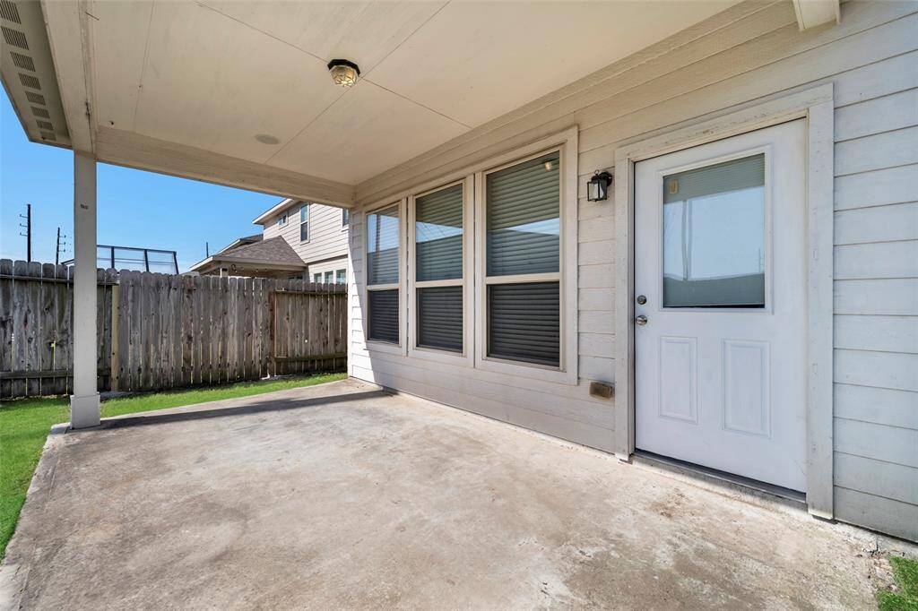 Spacious covered patio, perfect for outdoor relaxation and entertaining.