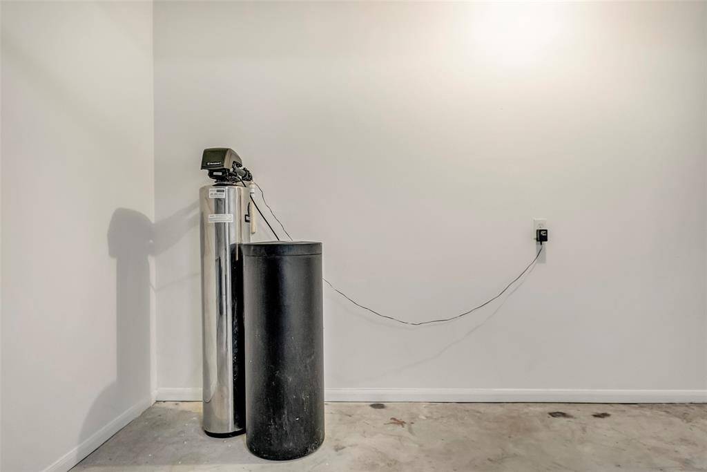 Conveniently located water softener in the garage for enhanced water quality.