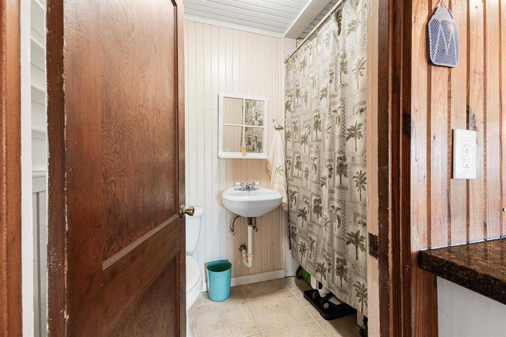 1/2 bath in great room with large storage area