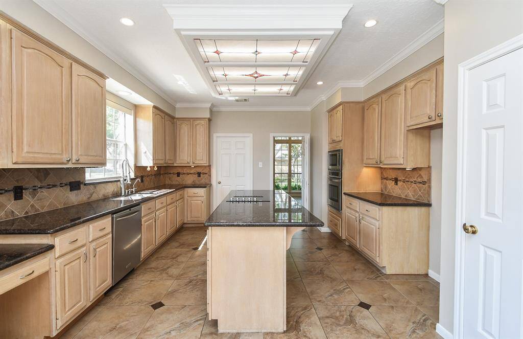 Expansive kitchen with a spacious island, perfect for cooking and entertaining.