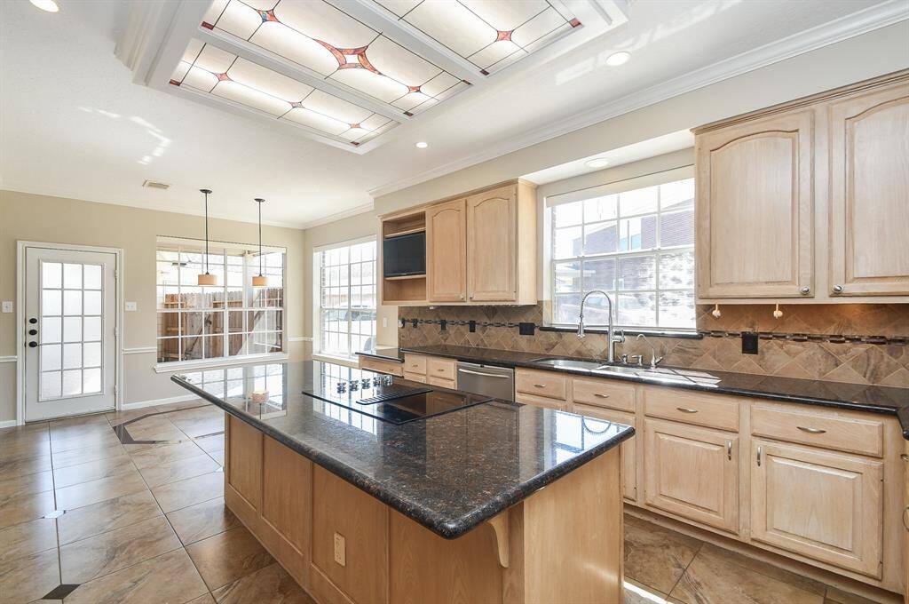 This kitchen boasts a spacious island perfect for dining and entertaining.