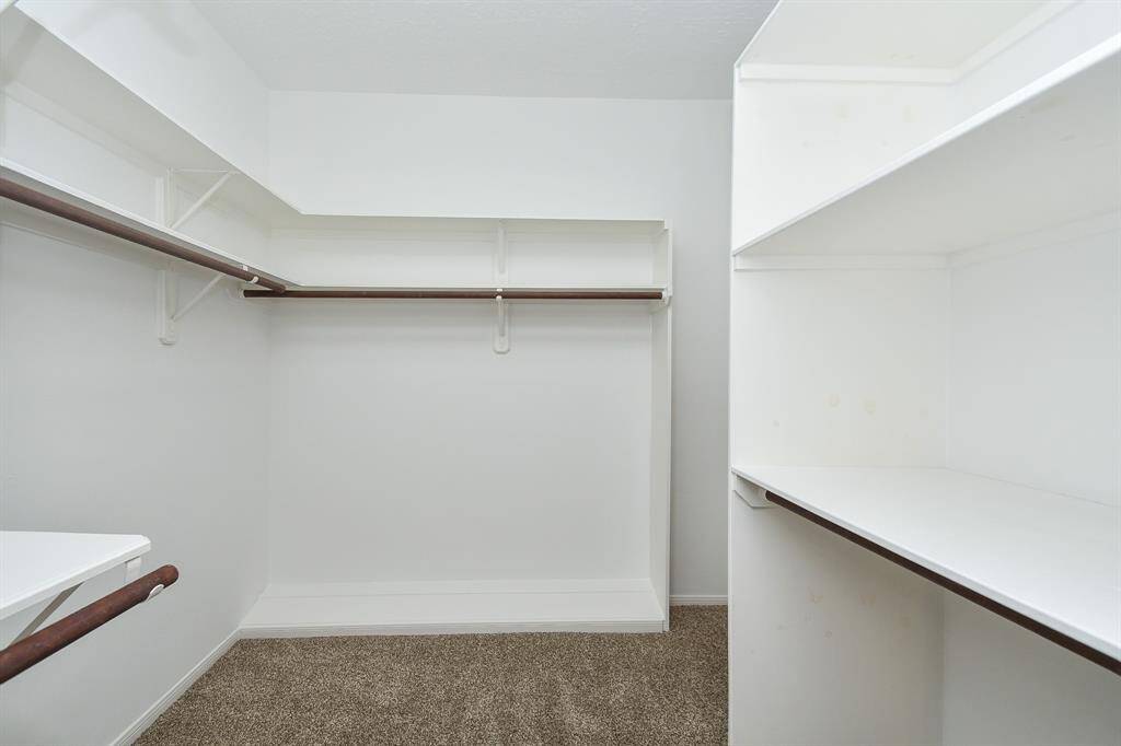 Expansive walk-in closet in the primary suite.