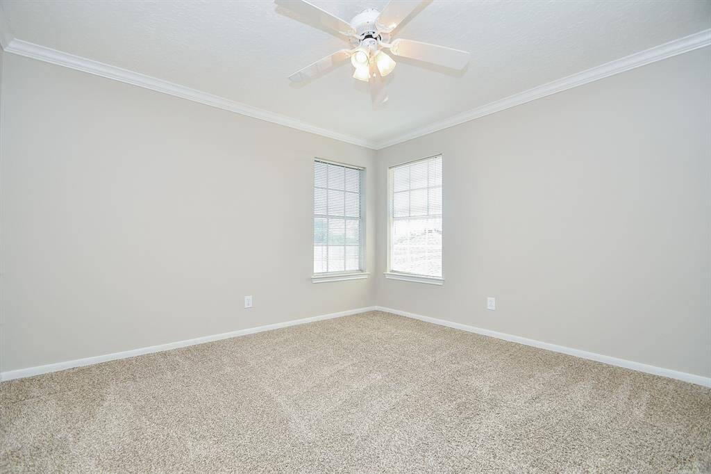 This inviting bedroom is one of three available secondary bedrooms located on the second floor.