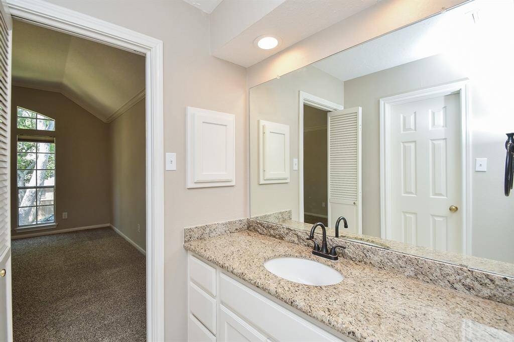 Convenient Jack and Jill bathroom connecting two bedrooms.