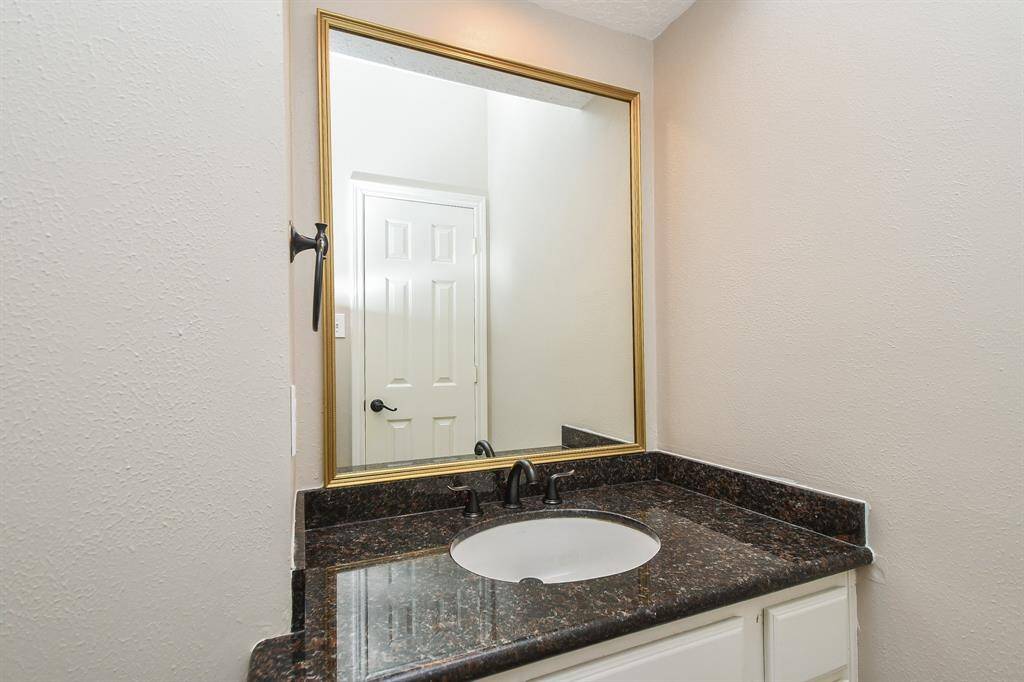 Powder bathroom is located on the first floor