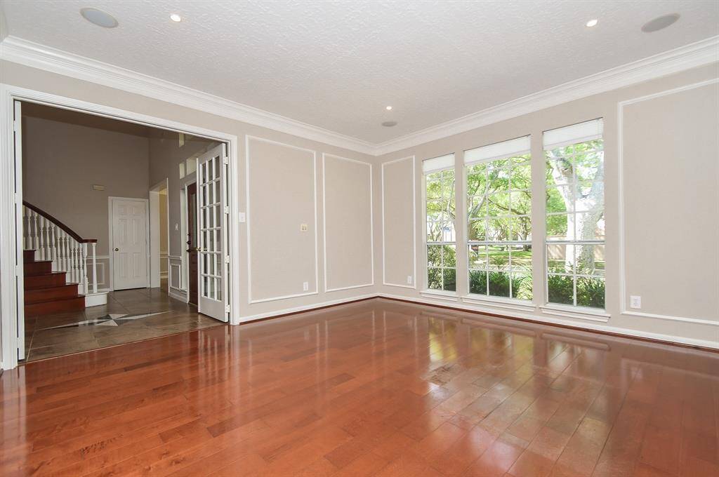 This versatile space can serve as a study or a formal living room, tailored to fit your lifestyle.