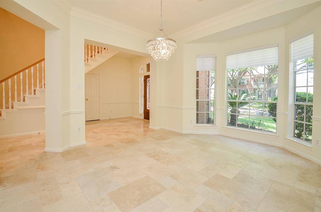 Another view of the formal dining room and foyer