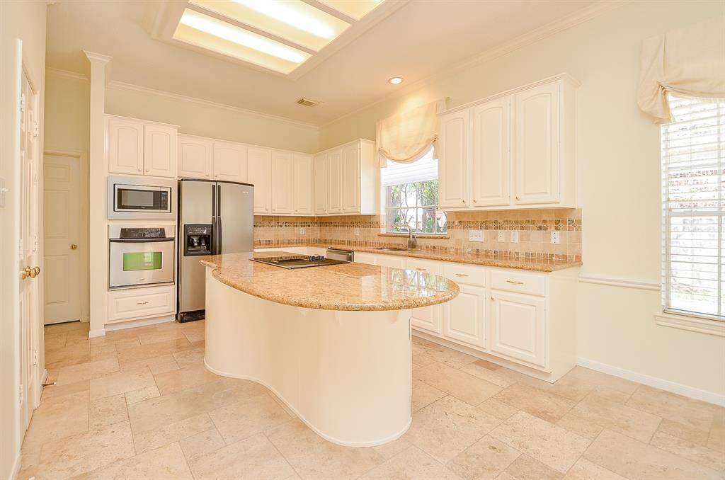 Granite countertops, stainless steel appliances, pantry