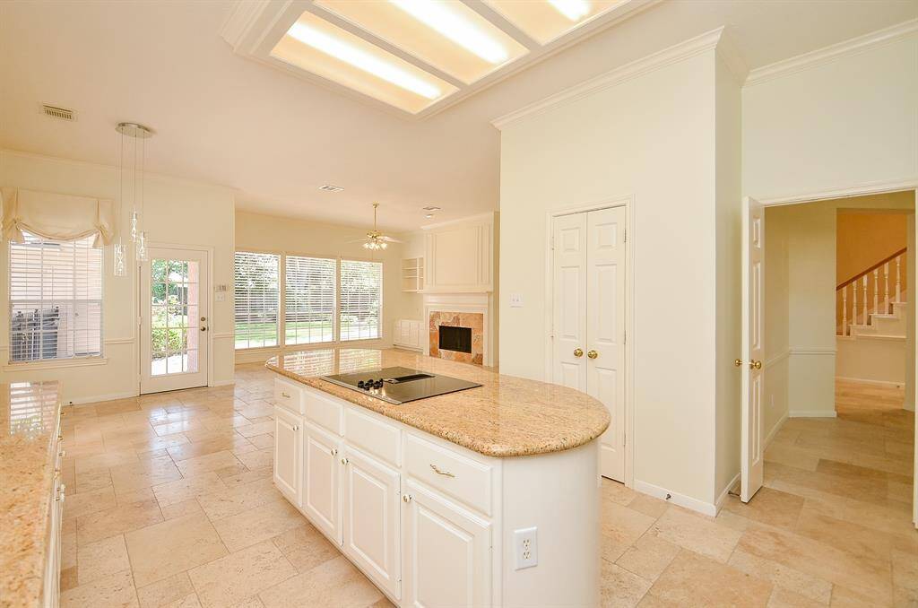 Another view of the kitchen leading to the formal dining on the right