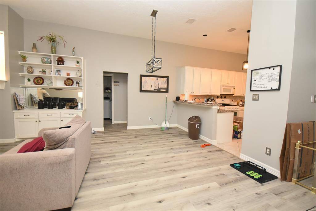 The dining room is adjacent to the breakfast bar and The dining room, conveniently situated next to the breakfast bar, offers an inviting space that’s perfect for entertaining family and friends. Its layout encourages warmth and connection, making every gathering a memorable event.is ideal for entertaining family and friends.
