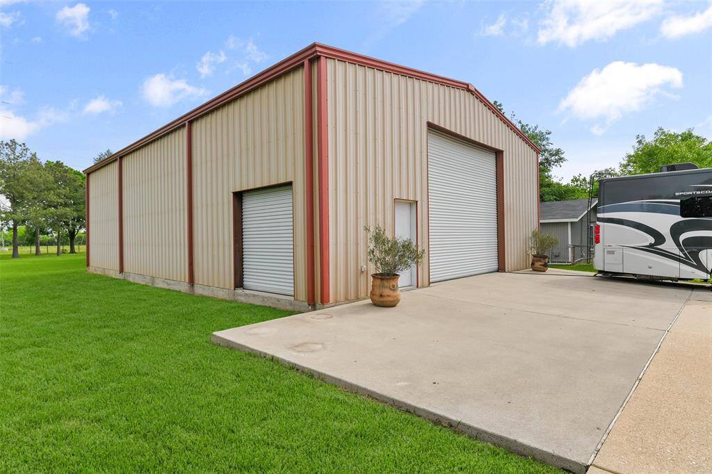 Run a business, enjoy a hobby, or store your toys in this 40'x60' metal workshop with three bay doors, a 20 amp breaker box on its own separate meter, and an extra sturdy 5-inch thick 3500 psi foundation. The possibilities are endless!