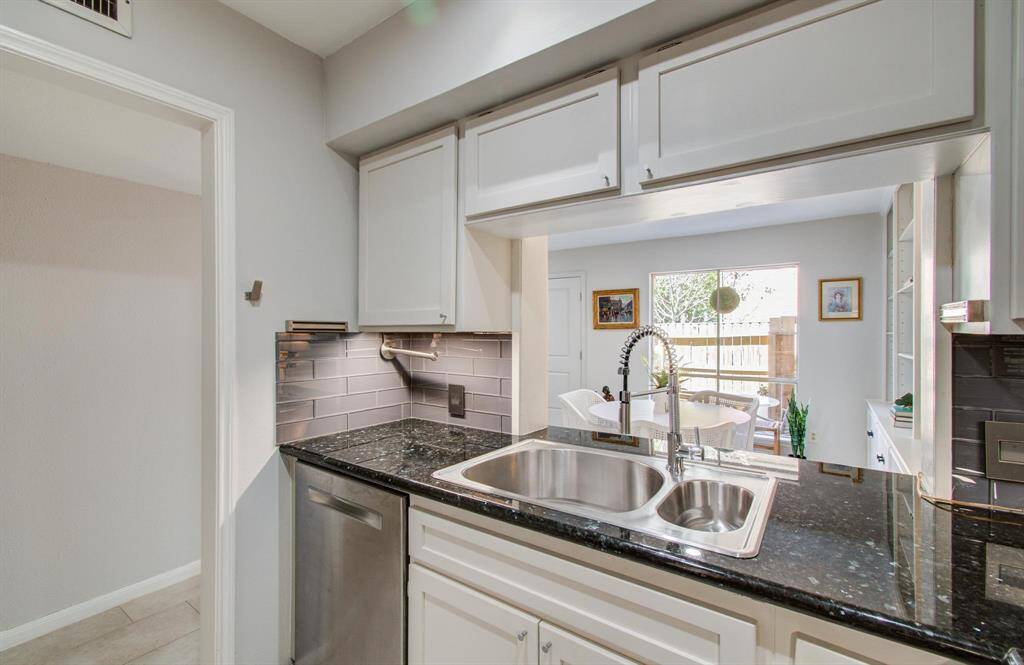 The open kitchen allows for an outside view from the sink and keeps you a part of the action in the dining area.