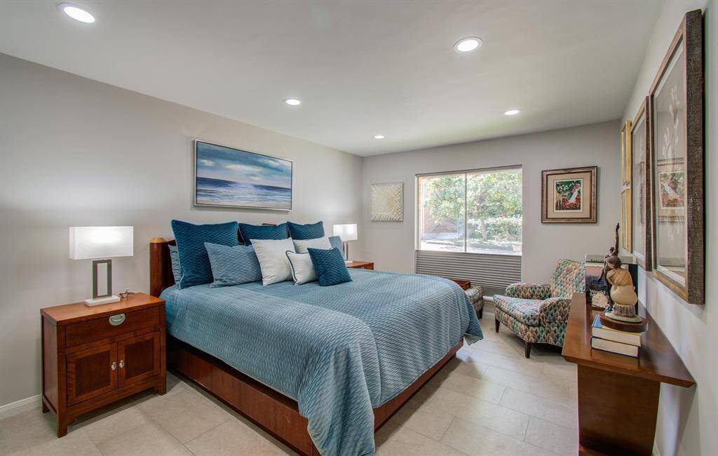 This relaxing retreat easily fits a king sized bed and generously-sized nightstands.