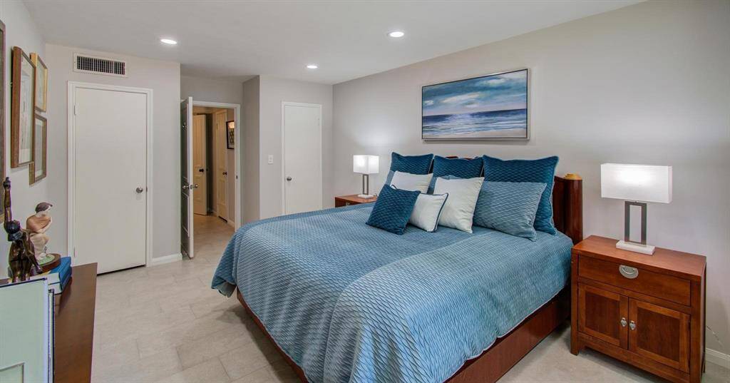 Along with the substantial amount of hanging space in the adjacent laundry room, this bedroom has two additional closets!