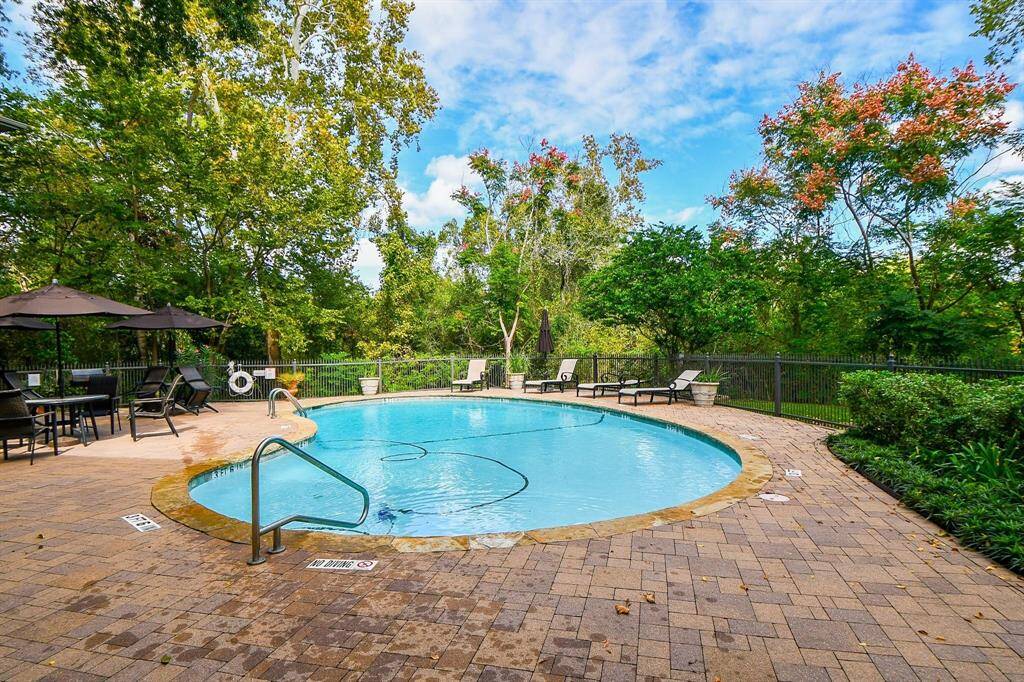 This sparkling, fully gated private pool is just steps away from the front door!