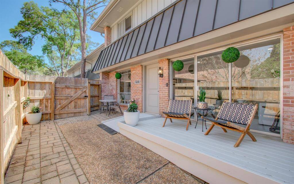 Guests' view as they enter your outdoor retreat.  Enjoy morning coffee on your deck (accessible through sliders) and dine al fresco in your outdoor dining space.  Plenty of room for gardening, too.