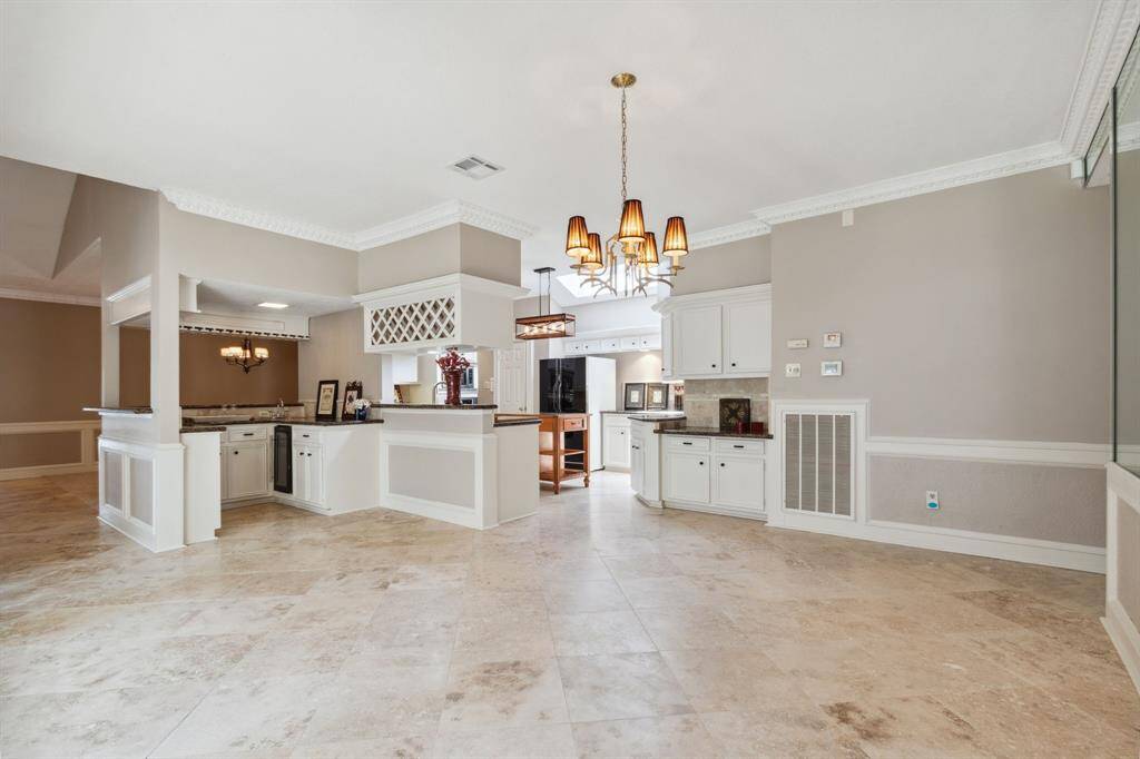 TRAVERTINE FLOORS CONTINUE.. ANOTHER VIEW OF BEVERAGE STATION.. LOTS OF CUSTOM MILLWORK & TRIM..