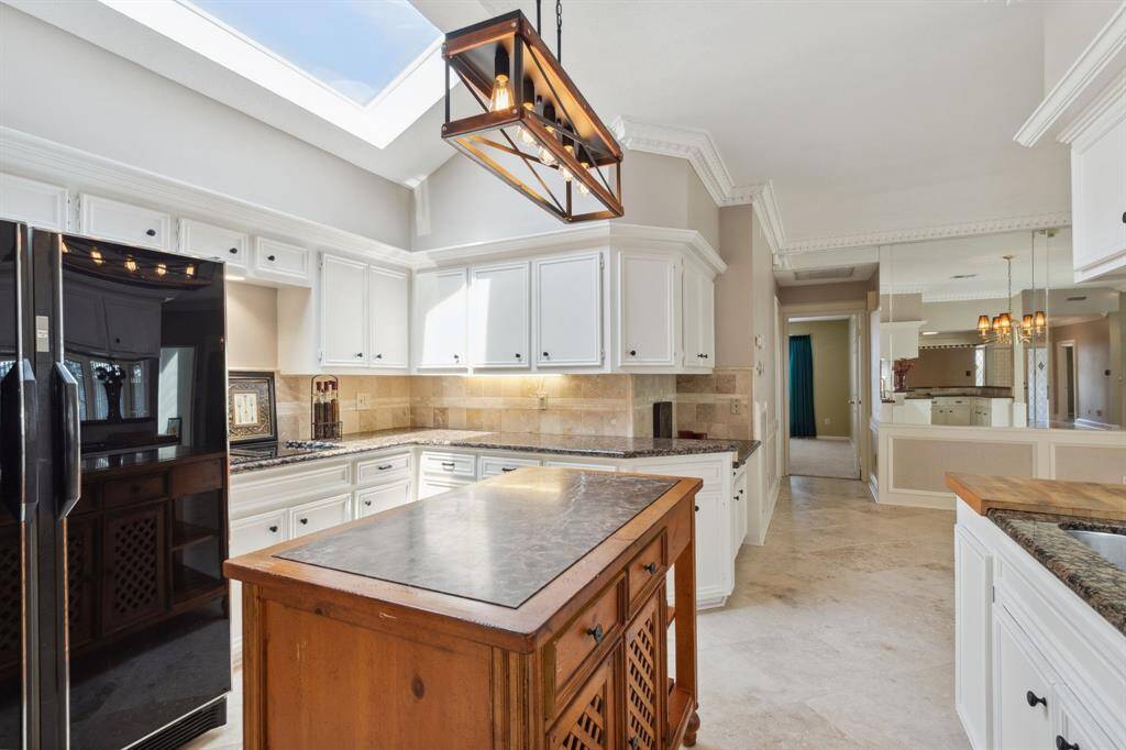 KITCHEN-AID ELECTRIC COOK TOP WITH DIRECT VENT... CENTER HALLWAY LEEDS TO PRIVATE SECONDARY BEDROOM .. AND ADDITIONAL BATH..