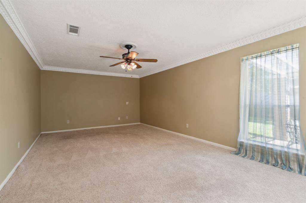 THE SPACIOUS 23' PRIMARY BEDROOM.. GREAT WALL SPACE FOR ALL THE FURNISHINGS PLUS ROOM FOR SITTING/READING/TV SPACE...