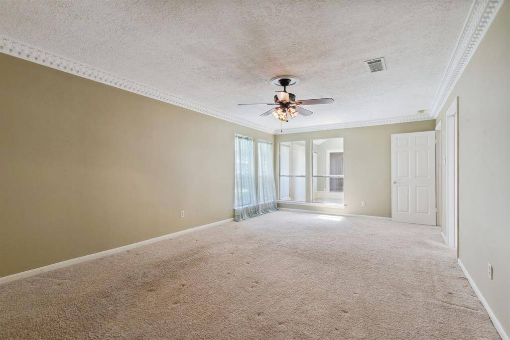 ANOTHER VIEW IN PRIMARY SUITE.. WINDOWS OPEN TO GARDENS, AS WELL AS DEN/SUN ROOM...