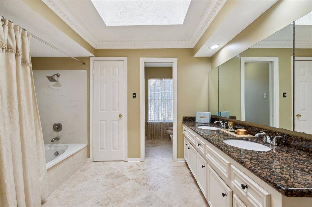 DUAL SINKS,  MIRRORS OPEN ON EITHER SIDE FOR CABINET/MEDICINE STORAGE.. PRIVATE WATER CLOSET WITH PERSONAL BIDET...