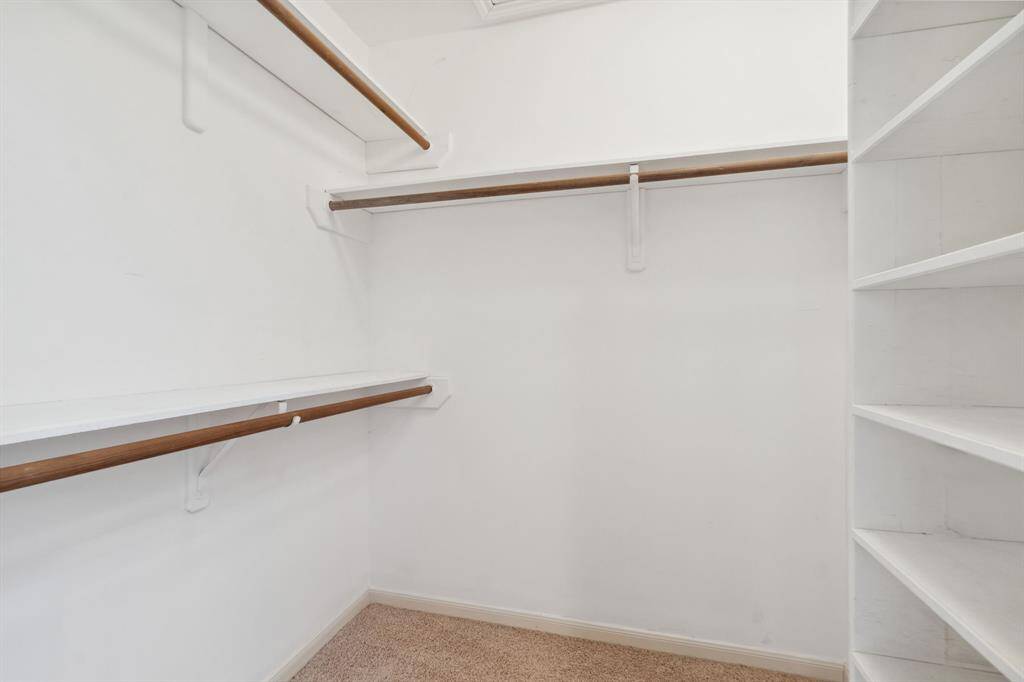 THE SMALLER OF THE 2  WALK-INS.. WITH ADDITIONAL SHELVING..