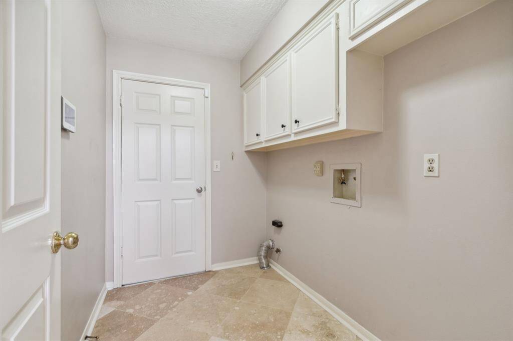 OVERSIZE UTILITY WITH SPACE FOR ADDITIONAL REFRIGERATOR OR FREEZER... OR JUST USE FOR HANGING SPACE...  DOOR TO GARAGE.. NEWER TECH CONTROL FOR SECURITY ON LEFT WALL..