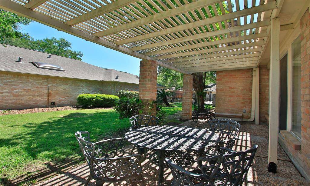 THE ADDITIONAL 1/2 LOT ADDS SO MUCH TO THE LIFESTYLE OF THIS GARDEN HOME...