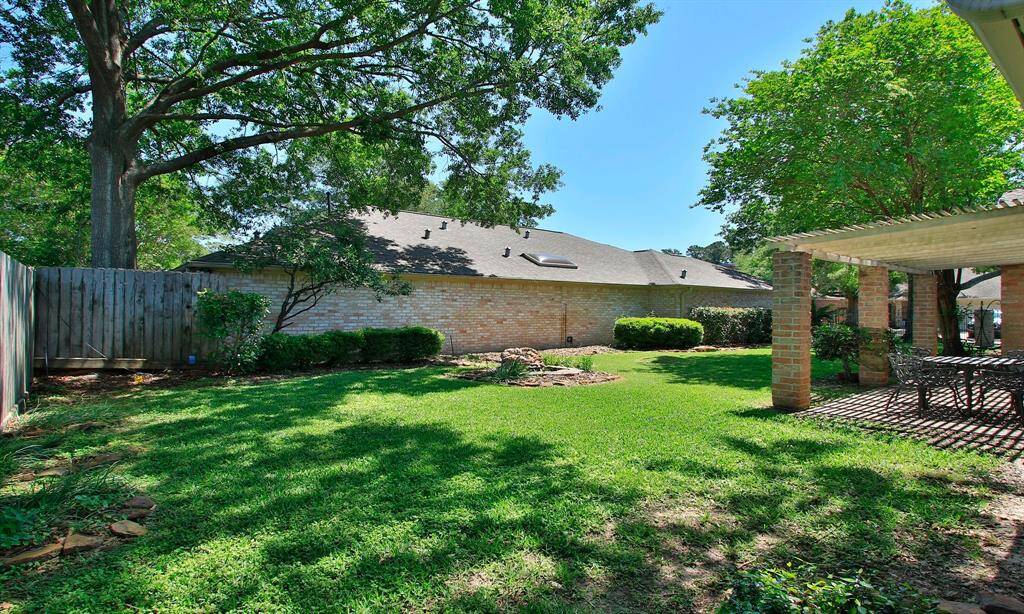 NICE TREES PROVIDE JUST THE RIGHT AMOUNT OF SHADE FOR YOUR GARDENING .. THE SMALL ROCK  POND IS A  NICE ACCENT...
