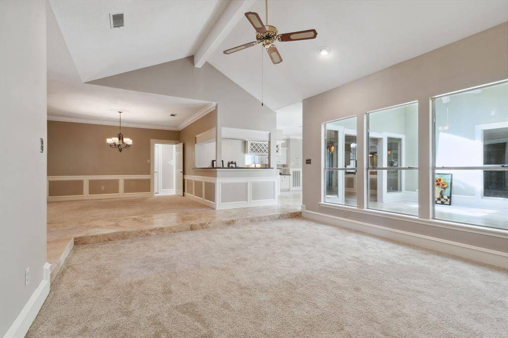 THE BEVERAGE BAR HAS 6' OF COUNTER SPACE ON BOTH DINING & HALL SIDE, FOR ADDITIONAL SEATING.. GREAT FLOW FOR ENTERTAINING... LOOKING INTO THE DEN/SUN ROOM THRU WINDOWS...