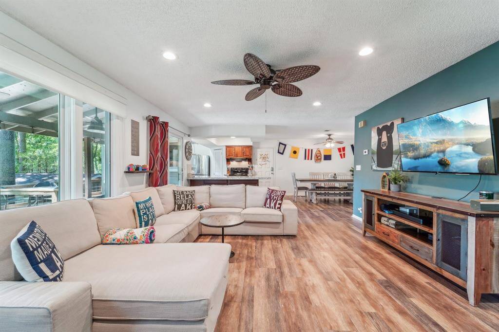 From the living area, enjoy a clear view of the open kitchen and open dining area—perfect for staying connected with family and guests while you cook or relax