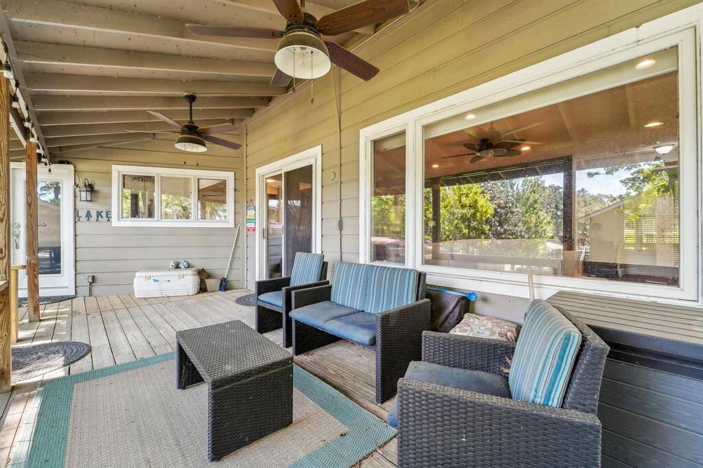 "Enjoy outdoor living on the large covered porch—ideal for relaxing in the shade, entertaining guests, or taking in peaceful views of the surrounding nature