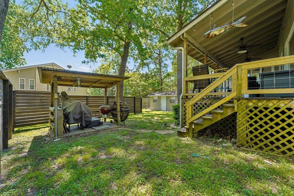 Covered grilling area with spacious yard