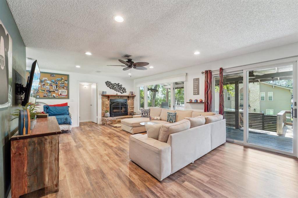 Spacious living area seamlessly flows into the open-concept kitchen, creating an inviting space perfect for entertaining and everyday living