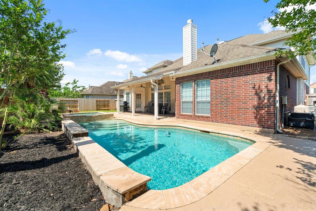 You'll love spending time in the backyard! Relax and unwind after a long day in the pool or entertain family and friends! With easy access to the living room and kitchen, it's the perfect entertaining space!