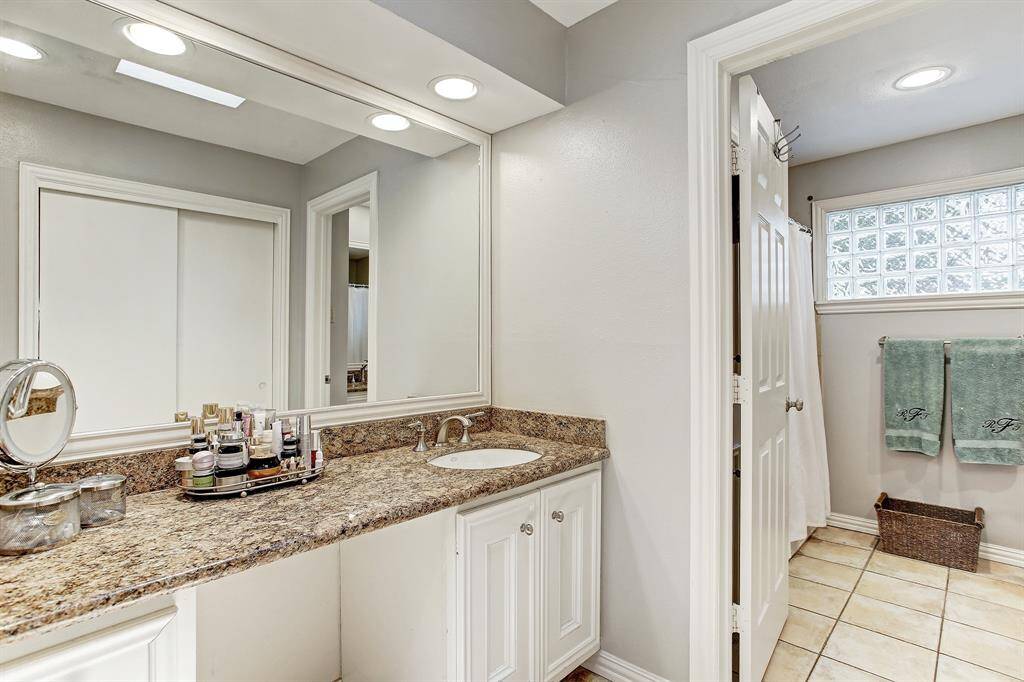 Master ensuite bath has granite counters, shower/tub combo  and two separate sinks. The second sink is inside the door (not pictured). The bathroom is larger than this photo depicts and has three spacious closets.