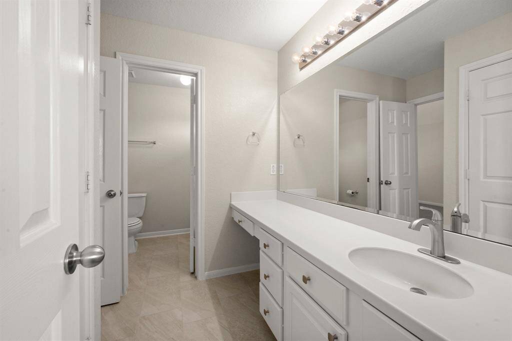 Adjoining upstairs bathroom with new tile (2025