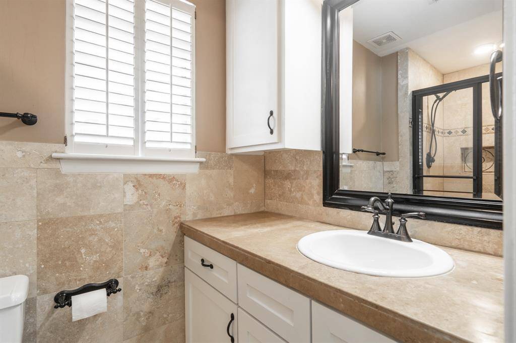 Vanity area of primary bathroom.