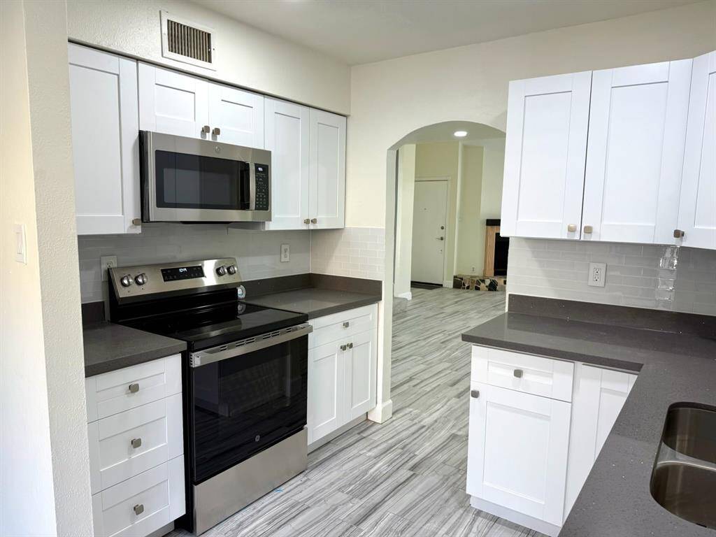 Discover the seamless flow from the kitchen to the dining room, perfect for entertaining.