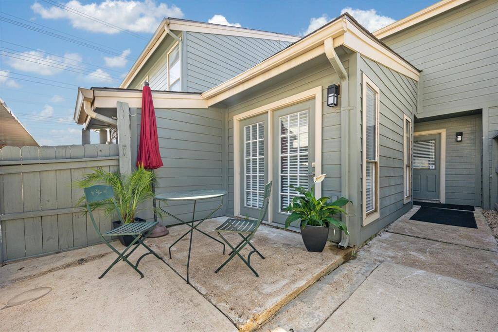 Another view of the backyard patio near your covered patio for convenient access.