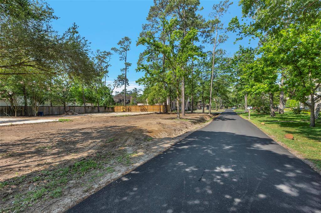 Spacious, cleared lot with mature trees, perfect for building your dream home in a serene neighborhood setting and a quite cul-de-sac lane.