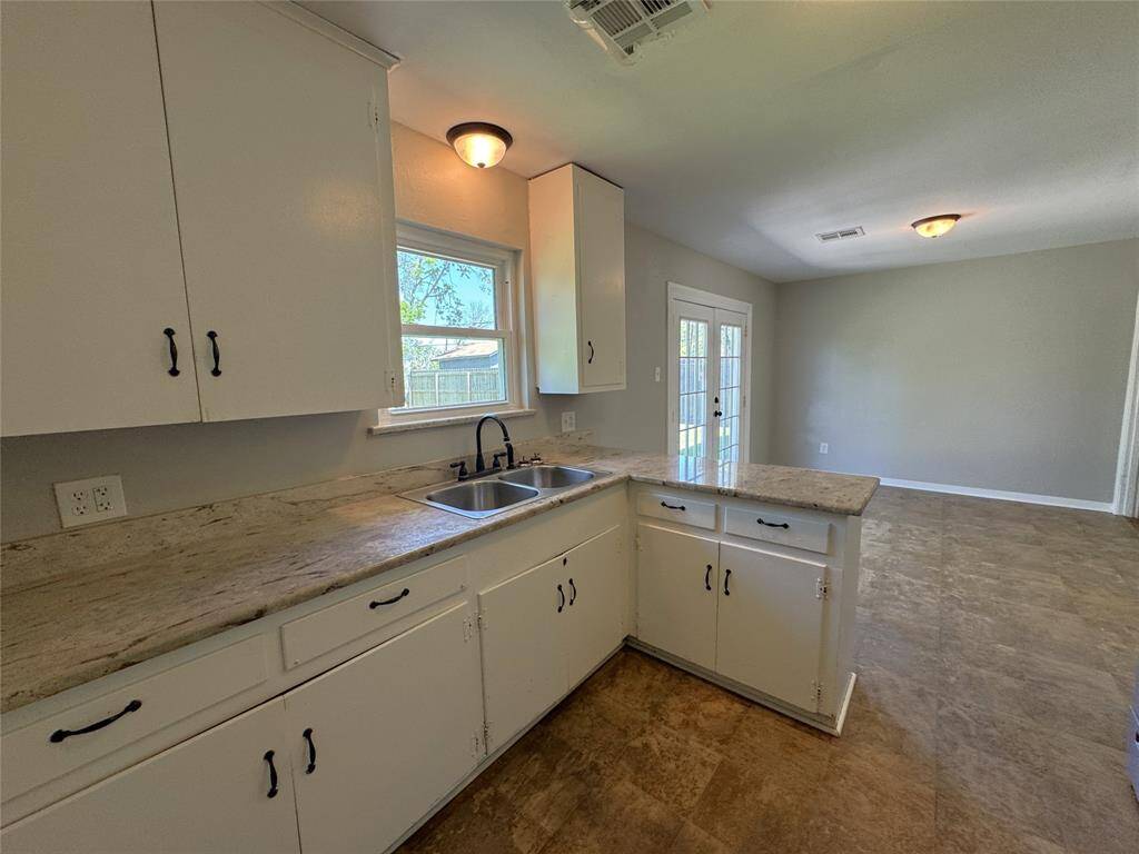 Great kitchen area with granite counter tops open to dining area